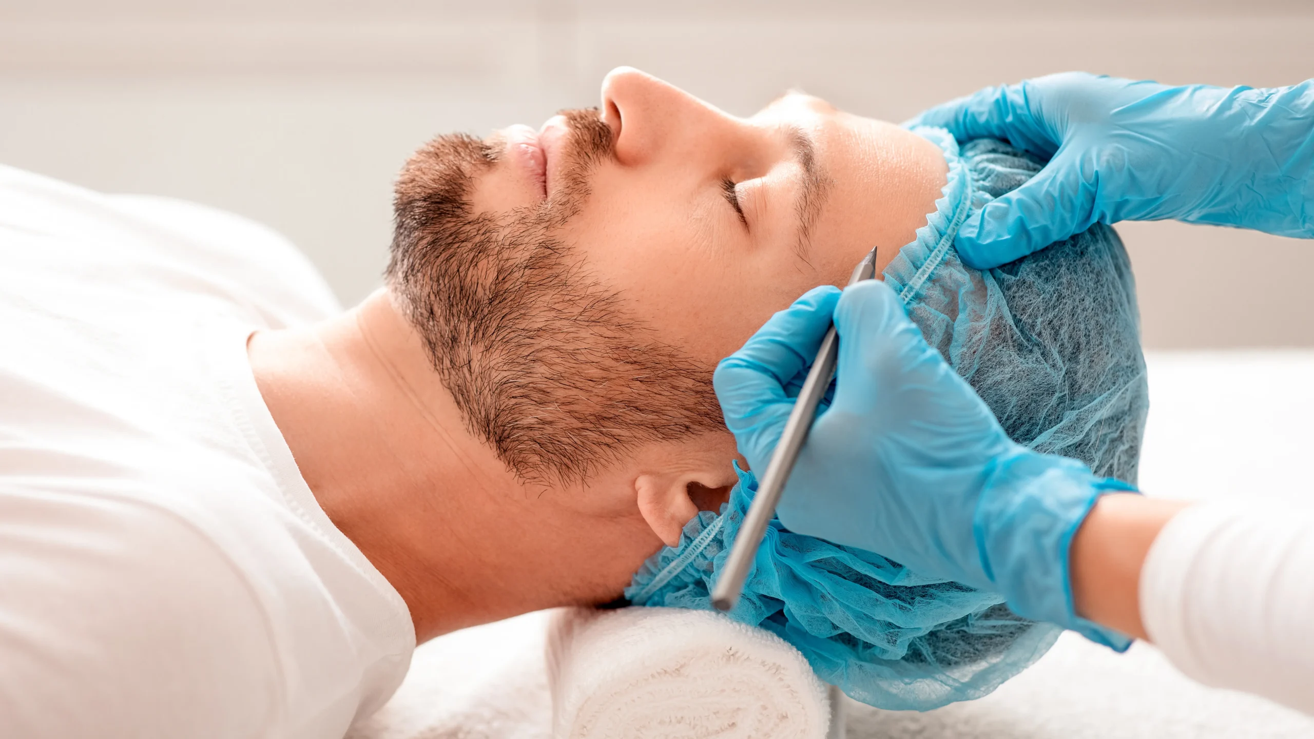 Patient in surgical cap preparing for surgery while learning about pre-surgical psychological evaluation requirements